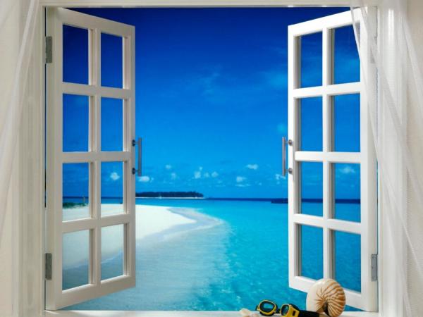 Wandbild mit dem Bild eines Fensters mit Blick auf den blauen Himmel und das transparente Meer