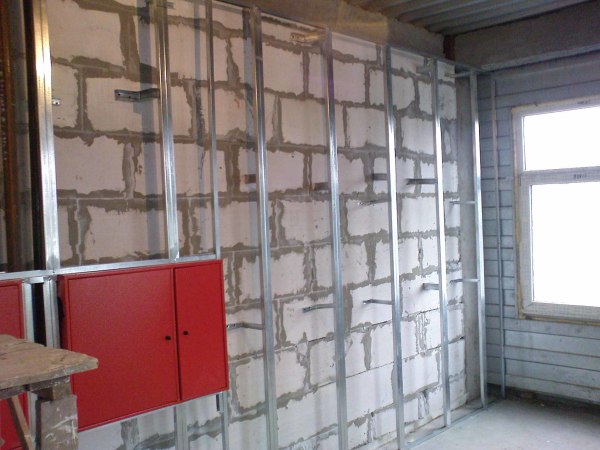 In the photo you see an example of building a metal frame on the walls of the foam block, for further sheathing with plasterboard sheets