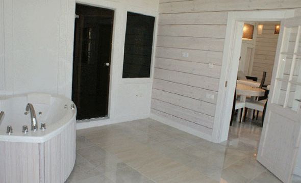 Interior painting of the walls of a wooden house in light shades Interior painting of the walls of a wooden house in light shades